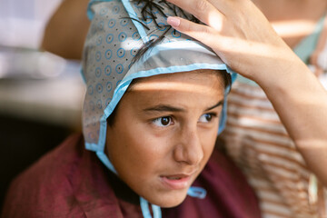 Preteen highlighting her hair