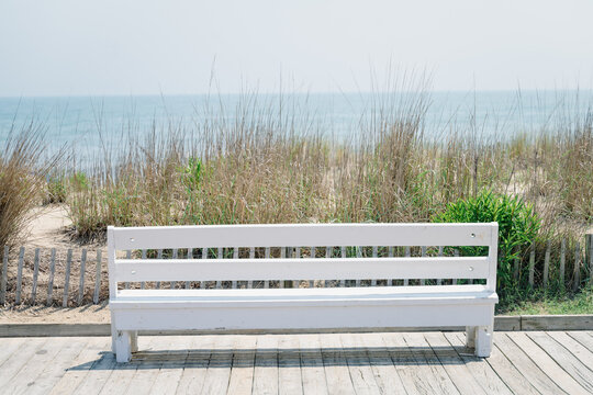 Boardwalk bench with beach view