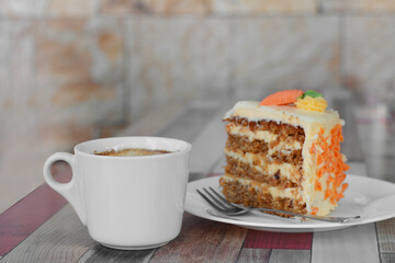 Delicious cake and cup of hot coffee on wooden table