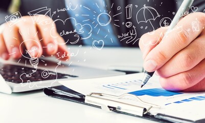 Business man writes in a notebook on the table
