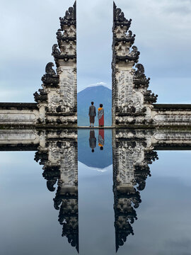Couple In Front Of Traditional Balinese Gate, Indonesia