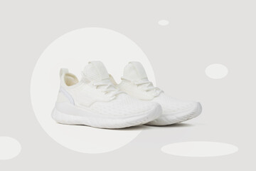 Stylish white sneakers on an abstract background.