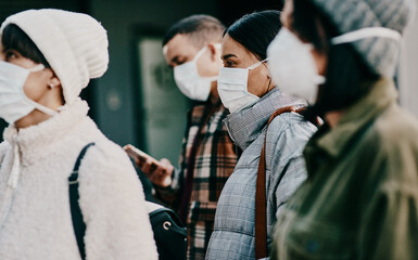 Fototapeta Traveling people wearing face mask in a covid pandemic in crowd, public or airport border with passport or travel restrictions. Foreigners wearing protection to prevent the spread of diseases abroad obraz