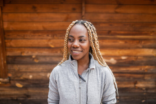 portrait of young black woman with blonde braids and sportswear