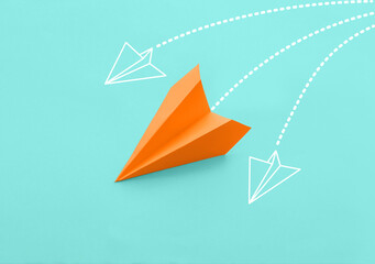 Paper plane on light blue background