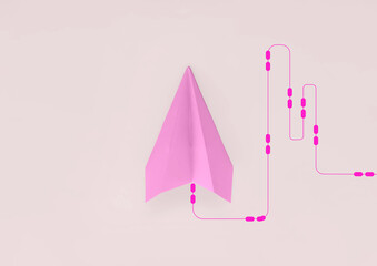 Paper plane on pink background