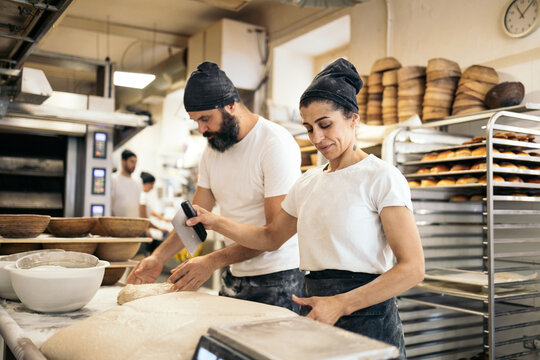 Bakers Preparing The Dough For The Bread Making