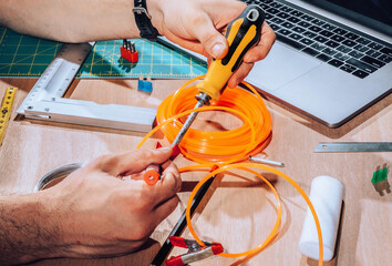 Technician working on wires and cables.