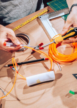 Technician working on wires and cables.