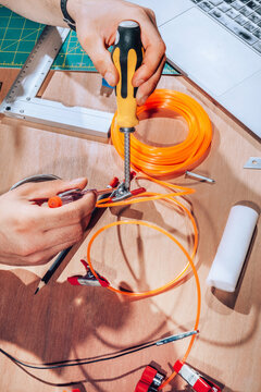 Technician working on wires and cables.