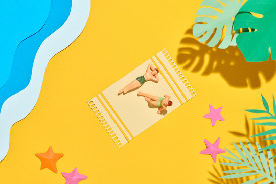  Hello summer, Two men sunbathing on the beach mat