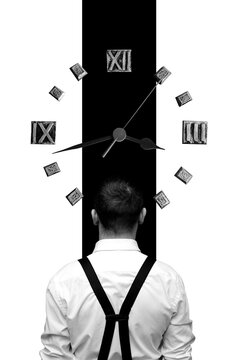 Businessman looking on clock