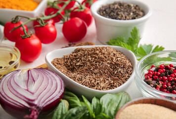 Bowls with different spices and fresh vegetables, closeup