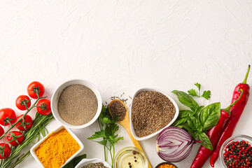 Composition with aromatic spices, herbs and vegetables on light background
