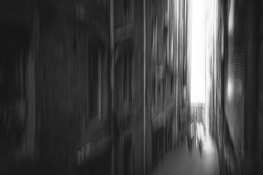 Narrow street in Edinburgh with vertical intentional camera movement