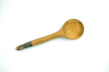 Old wooden spoon on a white background
