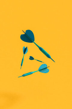 blue darts on yellow background