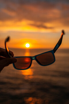 POV of sunglasses overlooking the sea