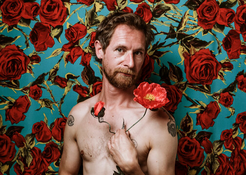Man with red flowers