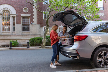 Mother and Daughter Moving in to University dorm room together 