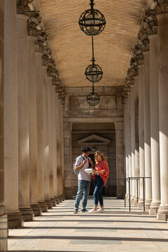 Two Gen Z Friends University Students review assignment on campus