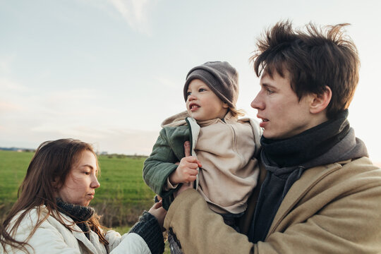 Mother fixes her child's cloth