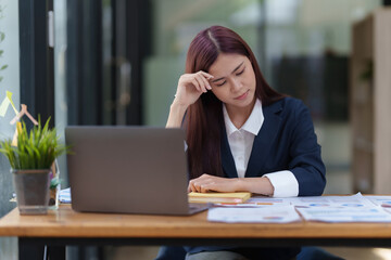 Fototapeta premium Business Finance audit tax Concept. Young business women analytics about marketing plan of this years