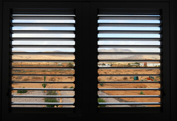 view at countryside Fuerteventura through shutters