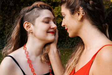 Lesbian couple outdoors relaxing