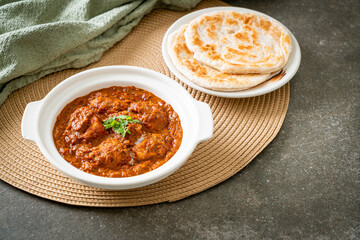 chicken tikka masala spicy curry meat food with roti or naan bread