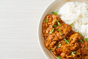 chicken tikka masala with rice on plate
