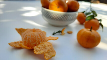 Blur photo, Mandarin oranges in bowl and peeled isolated on white background 02