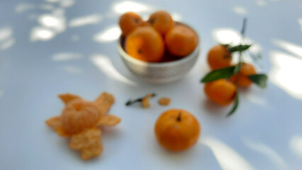 Blur photo, Mandarin oranges in bowl and peeled isolated on white background 03
