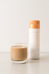 coffee latte glass with ready to drink coffee bottles