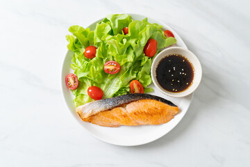 grilled salmon fillet steak with salad