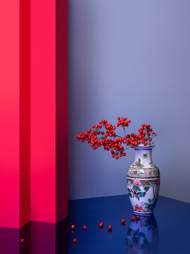 Asian vibes still life with red flowers in a Chinese vase