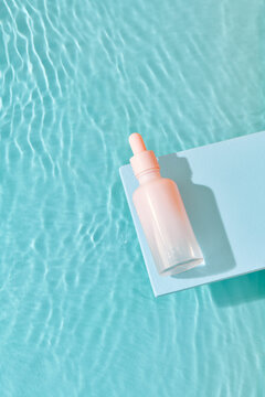 glass transparent container with beauty oil or serum and pipette