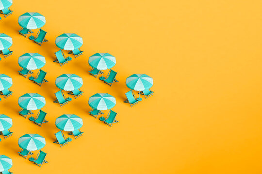 triangle from blue beach umbrellas and chairs