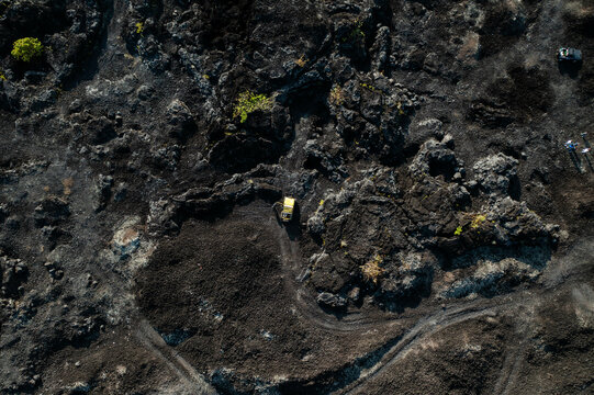 From above texture of volcano rocks and sand from lava at Mount Batur