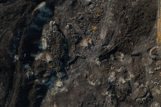 From above texture of volcano rocks and sand from lava at Mount Batur