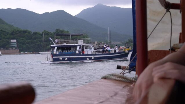 Boat sailing on a lake on a cloudy day