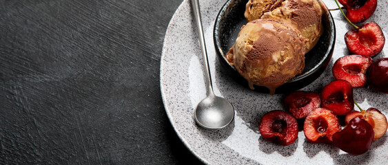 Chocolate ice cream with berries on dark background