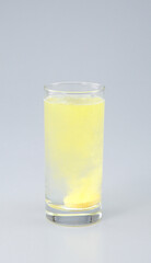 Vitamin C with B complex , Calcium , Magnesium Tablet dissolved in a glass of water.