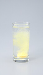 Vitamin C with B complex , Calcium , Magnesium Tablet dissolved in a glass of water.