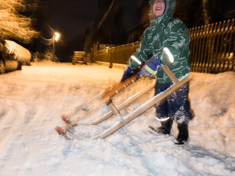 UGC photo of a boy having fun with sledge in  snow during the winter 