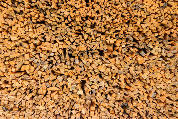 Background of the stacked dry chopped firewood
