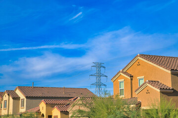 Suburban neighborhood with a view of transmission tower against the sky in Tucson, Arizona