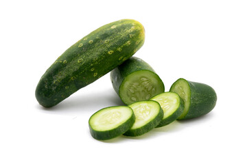 whole cucumber and slices over on background