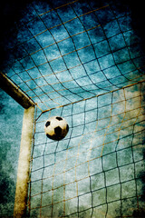 soccer post and ball into the net , with a gritty effect - obrazy, fototapety, plakaty