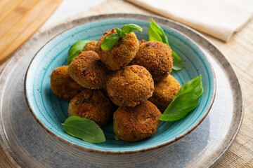 Vegan broccoli croquettes with goat cheese.